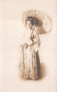 RPPC WOMAN WITH HAND FAN & UMBRELLA BEAUTIFUL DRESS REAL PHOTO POSTCARD (c.1910)