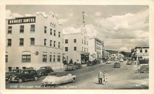 Postcard RPPC Idaho Coeur D' Alene Sherman Avenue autos hotel 23-11345