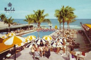 THE MONTE CARLO RESORT HOTEL guests poolside MIAMI BEACH, FL 1963