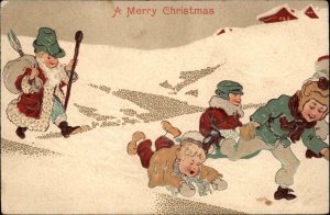 Christmas - Children Play in Snow Boy as santa Claus PFB c1910 Postcard