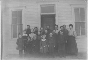 Battle Creek-Eckford Michigan?~Group of Children & Adults Posing by Bldg~RPPC