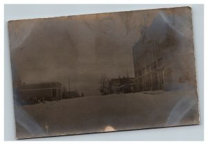 Vintage 1900's RPPC Postcard Overexposed Street Scene Snow Covered Main Street
