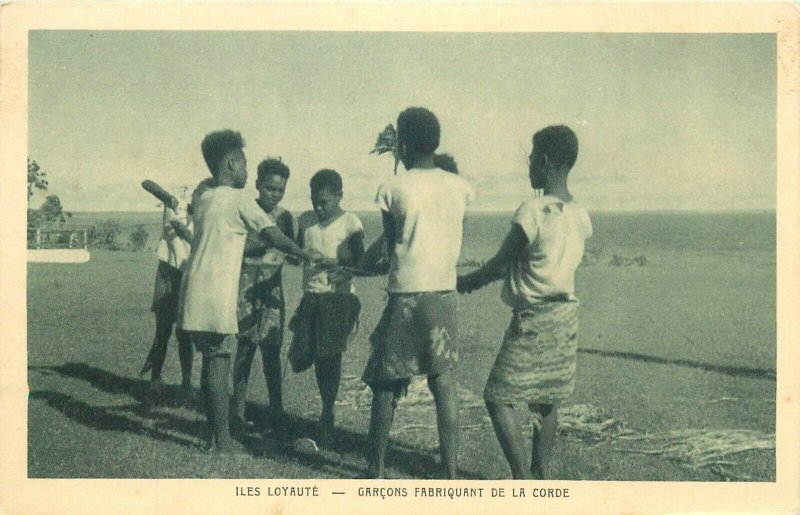 New Caledonia Loyalty Islands Province ethnic boys making rope