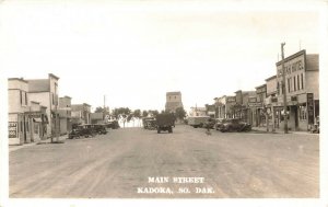 Kadoka SD Main Street Storefronts Tourist Cafe Old Cars Trucks RPPC