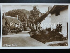 somerset DUNSTER Old Cottages showing man in garden - Old RP Postcard