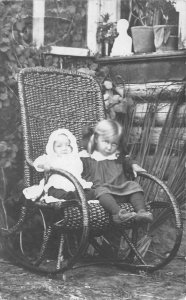 Children Girl and Baby in Wicker Rocking Chair Real Photo Postcard AA60101