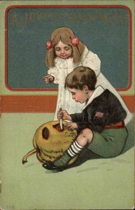 Halloween Children Carving Pumpkin c1910 Embossed #778 c1910 Postcard bnhs