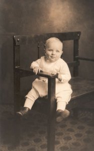 Vintage Postcard A Smiling Baby Sitting On A Chair Charming Infant