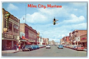 c1950's Drugstore Clubs Cafe Looking East on Main Street Miles City MT Postcard