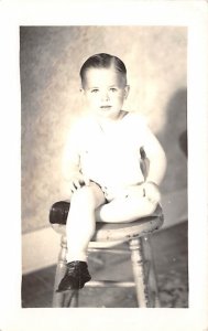 Little boy sitting on a stool Children Unused 