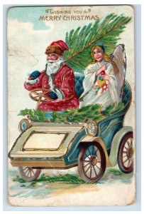 C.1910 Santa Claus w/ Angel Driving Tree Mica Holly. Postcard P11e