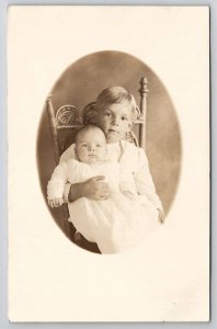 Cute Little Boy Holding Baby Sister or Brother RPPC Postcard E25
