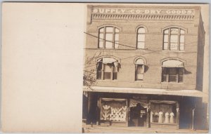 Supply Co Dry Goods Ladies Dresses in Window Unidentified Location Postcard H80