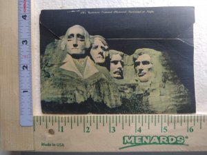 Postcard Folder Mt. Rushmore National Memorial Illuminated at Night, S. D.