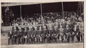 LARGE GROUP OF MEN IN FRONT OF CROWD STADIUM/BLEACHER~1910s REAL PHOTO POSTCARD