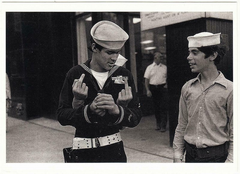 Sailor Holding The Finger Statuettes in Times Square NYC 1975 Postcard