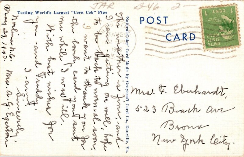 People Testing Worlds Largest Corn Cob Pipe Tobacco Field Barns