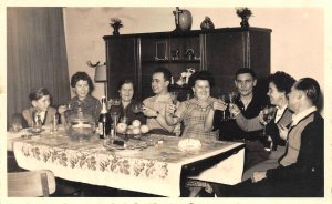 RPPC,~ FAMILY At Dining Table  CELEBRATION~Champagne Toast  REAL PHOTO Postcard