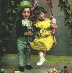 Adorable Children on Swing Boy Girl Flowers Spring Yellow Dress 1909 Postcard