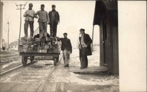 Railroad Station Working Men RR Ties on RR Wagon Labor c1910 Real Photo Postcard