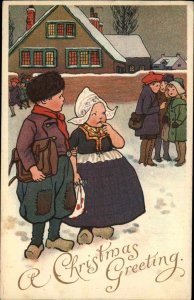 E. Nister No. 1992 Christmas Dutch Boy and Girl in Village c1910 Postcard