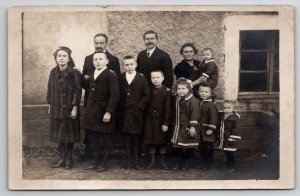 RPPC Large Family Children Dressed in A Row Postcard D24