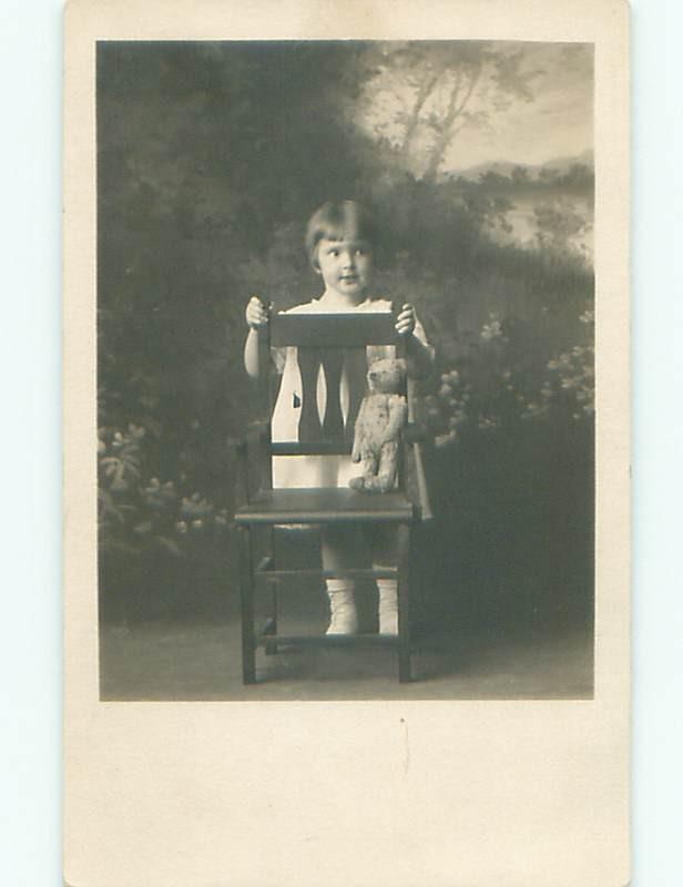 rppc Pre-1918 GIRL PUTS ANTIQUE TEDDY BEAR ON CHAIR - PROBABLY A STEIFF AC7669