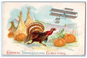 1911 Thanksgiving Greetings Turkey Pumpkin Wheat Airplane Embossed Postcard 