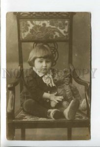 431960 Boy on chair with his favorite teddy bear like Christopher Robin photo 