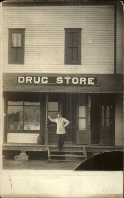 Man Standing in Front of Drugstore DRUG STORE Sign c1910 Real Photo Postcard