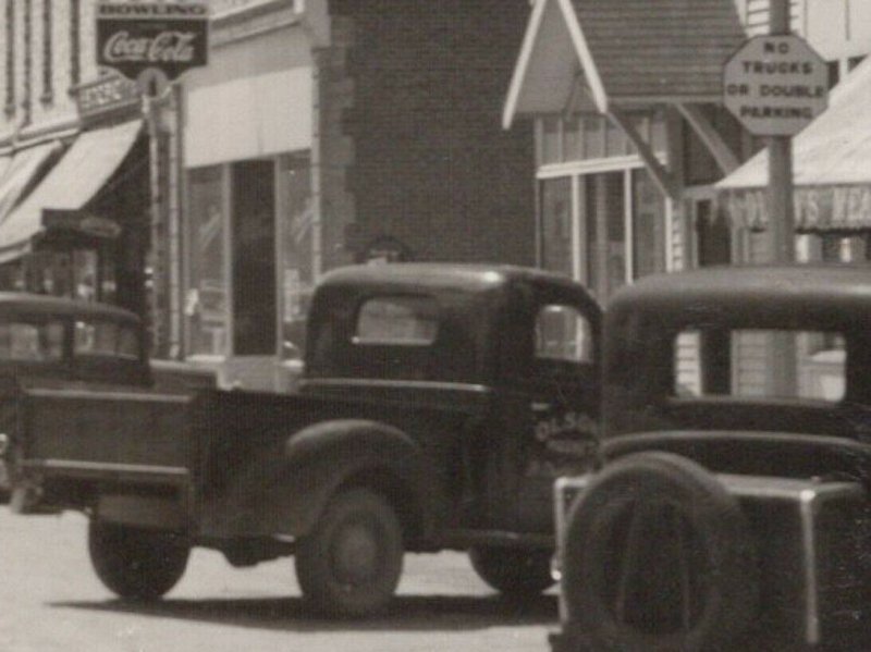 St Charles MN~Main St~1930s Cars~Olson Meat Market Truck Illegally Parked~RPPC 