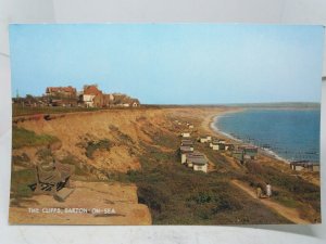 Beach Huts under The  Cliffs Barton on Sea Norfolk Vintage Postcard 1970s