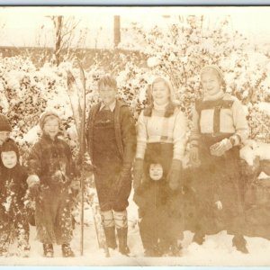 1931 Winter Family Photo in Snow RPPC Postcard Skiing Children Smiling Happy A40