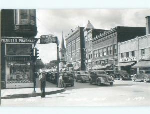 Pre-1950 rppc SHOPS ALONG STREET Alpena Michigan MI W0206