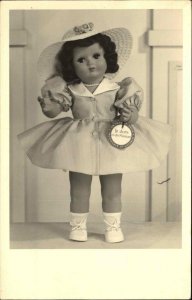 Advertising? - Doll Toy Close-Up Holding Tag c1930s-40s Reak Photo Postcard
