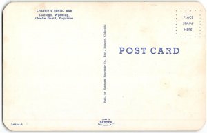 CHARLIE'S RUSTIC BAR Saratoga, Wyoming Saloon Interior 1950s Vintage Postcard