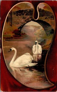 VINTAGE POSTCARD PAIR OF SWANS ON A HEART-SHAPED LAKE UNDER BRIDGE EMBOSS c 1910