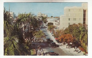 P1967 1966 postcard bay street scene old cars etc nassau bahamas queen stamp