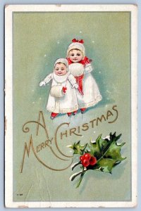 1914 MERRY CHRISTMAS GIRLS MUFFS WHITE COATS EMBOSSED VICTORIAN ANTIQUE POSTCARD