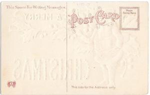 Embossed SANTA Claus Holding Present and Pointer - Vintage Christmas Postcard