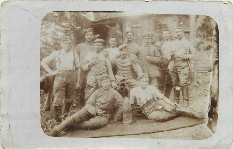 Military soldiers & horse stable early regimental real photo postcard