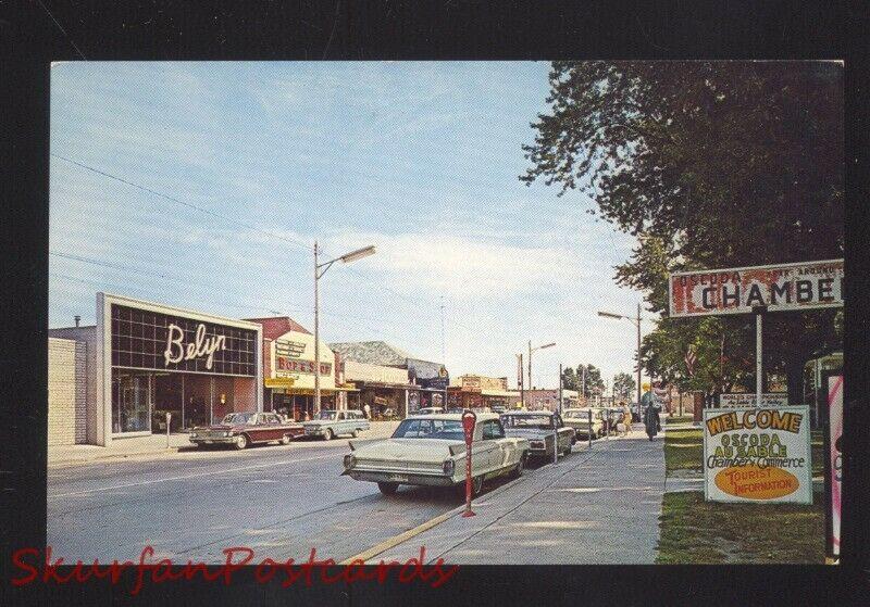 OSCODA MICHIGAN DOWNTOWN STREET SCENE 1960's CARS 1963 CADILLAC OLD POSTCARD