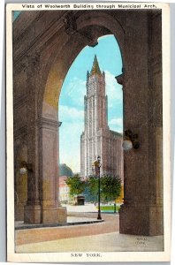 Postcard NYC Woolworth Building view through Municpal Arch