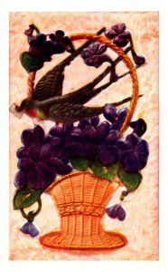 Violets  in basket with bird