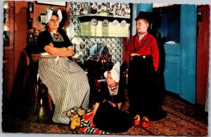 Postcard Netherlands Volendam Woman and children in traditional dress