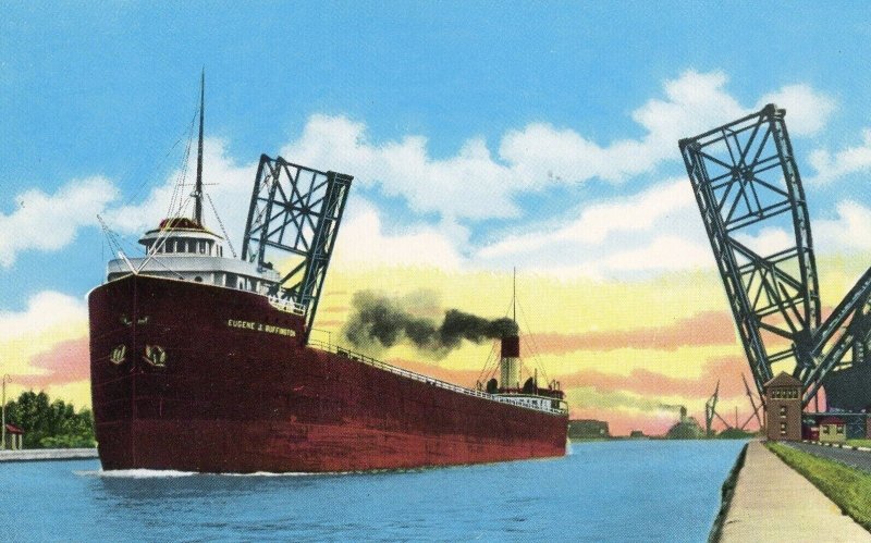 Postcard View of an Empty Freighter passing Bascule Bridge , Lake Superior, MI.