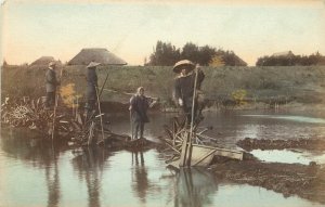 Hand Colored Postcard Japanese Stilit Walkers in Rice Paddies Water Wheels