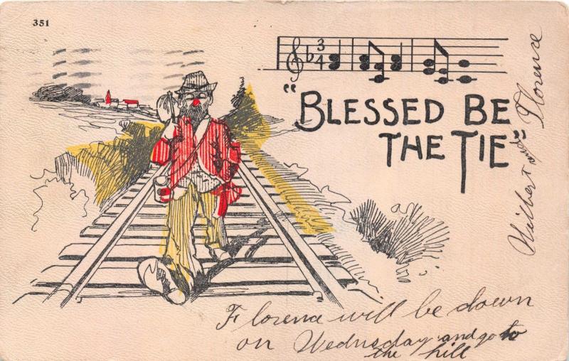 BLESSED BE THE TIE...HOBO WALKING DOWN RAILROAD TRACKS COMIC POSTCARD 1905