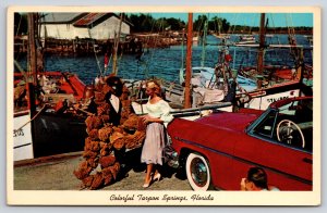 Tarpon Springs Florida~Woman Inspects Sponges~Sailboats~c1950s Car~1954 Postcard