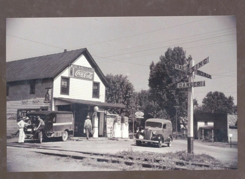 REAL PHOTO ATLANTA OHIO GROCERY STORE RAILROAD TRACKS OLD CARS POSTCARD